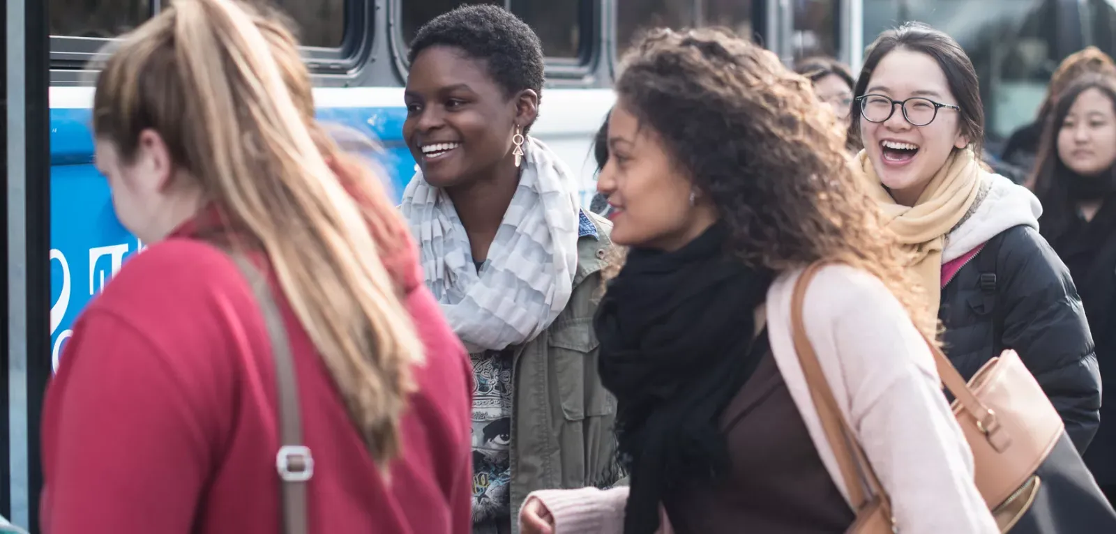 students on blue bus